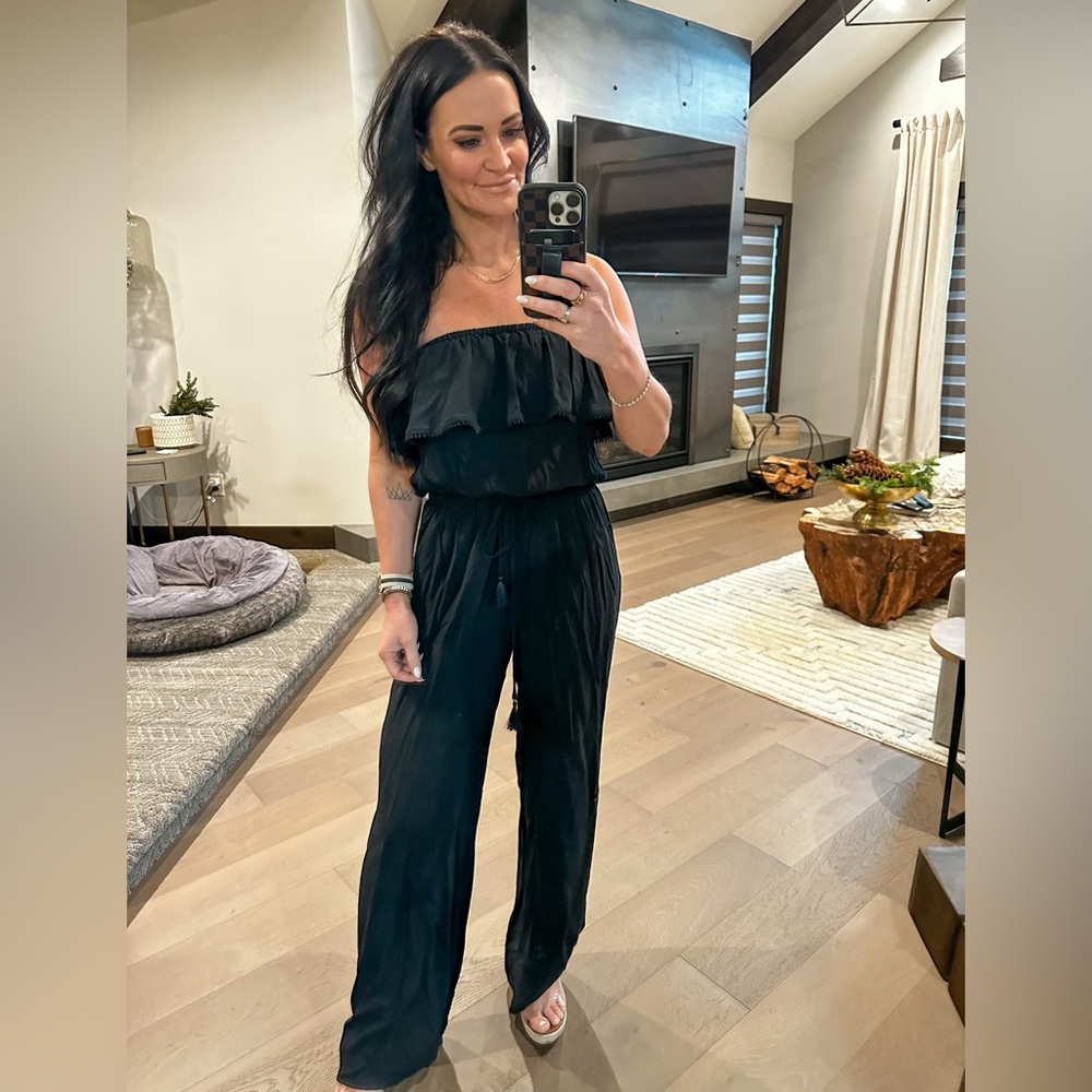 Victoria’s Secret black strapless jumpsuit. Size medium Ruffle and tassel detail